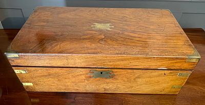 A brass bound mahogany writing slope. A brass bound Victorian mahogany campaign style writing slope.