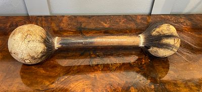 A Shaman Rattle With Wooden Shaft And Rattles Either Side With Hair Around