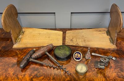 An Assortment of Vintage and Antique Collectibles Including Bookends, Corkscrews, and a Pocket 