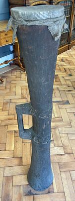 A Large Papua New Guinea Carved Wood Kundu Drum with Lizard Skin Top. This ethnographic musical 