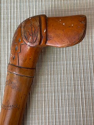 Two Antique Carved Folk Art Walking Sticks including a Boer War St. Helena Example. This lot 