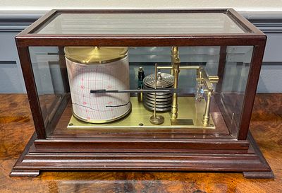 O. Comitti and Son London Mahogany and Brass Cased Barograph. This barograph is a recording 