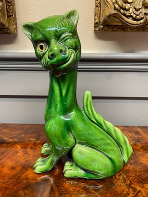 Attributed to Watcombe Pottery Grotesque Winking Cat Figurine. This ceramic figurine depicts a 
