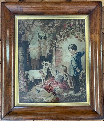 Framed Needlepoint Pastoral Scene with Children and Goat. This framed textile artwork features a 