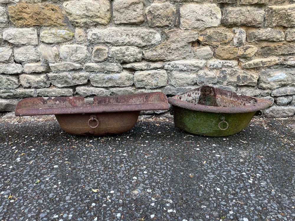 Lot 116a – A Pair of Antique Cast Iron Corner Stable Feeders