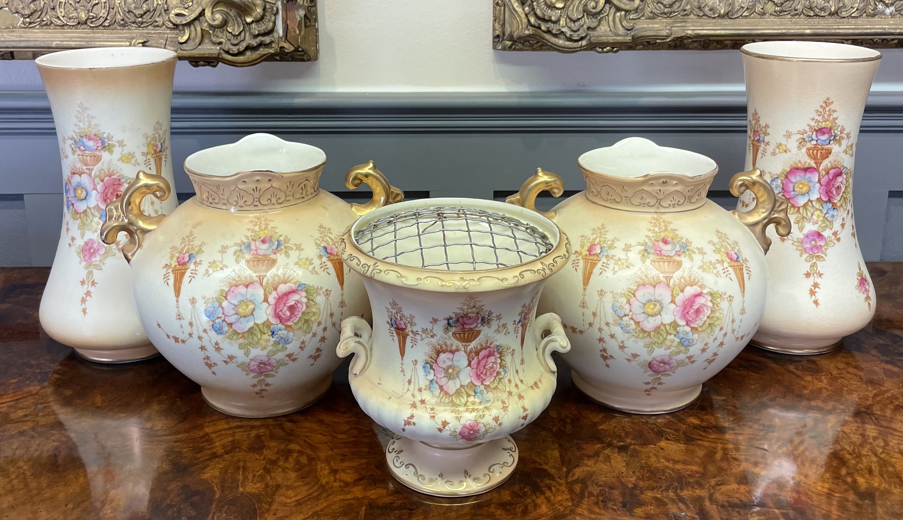 A Five-Piece Crown Devon Fieldings Blushed Ivory Spring Pattern Ceramic Garniture Set