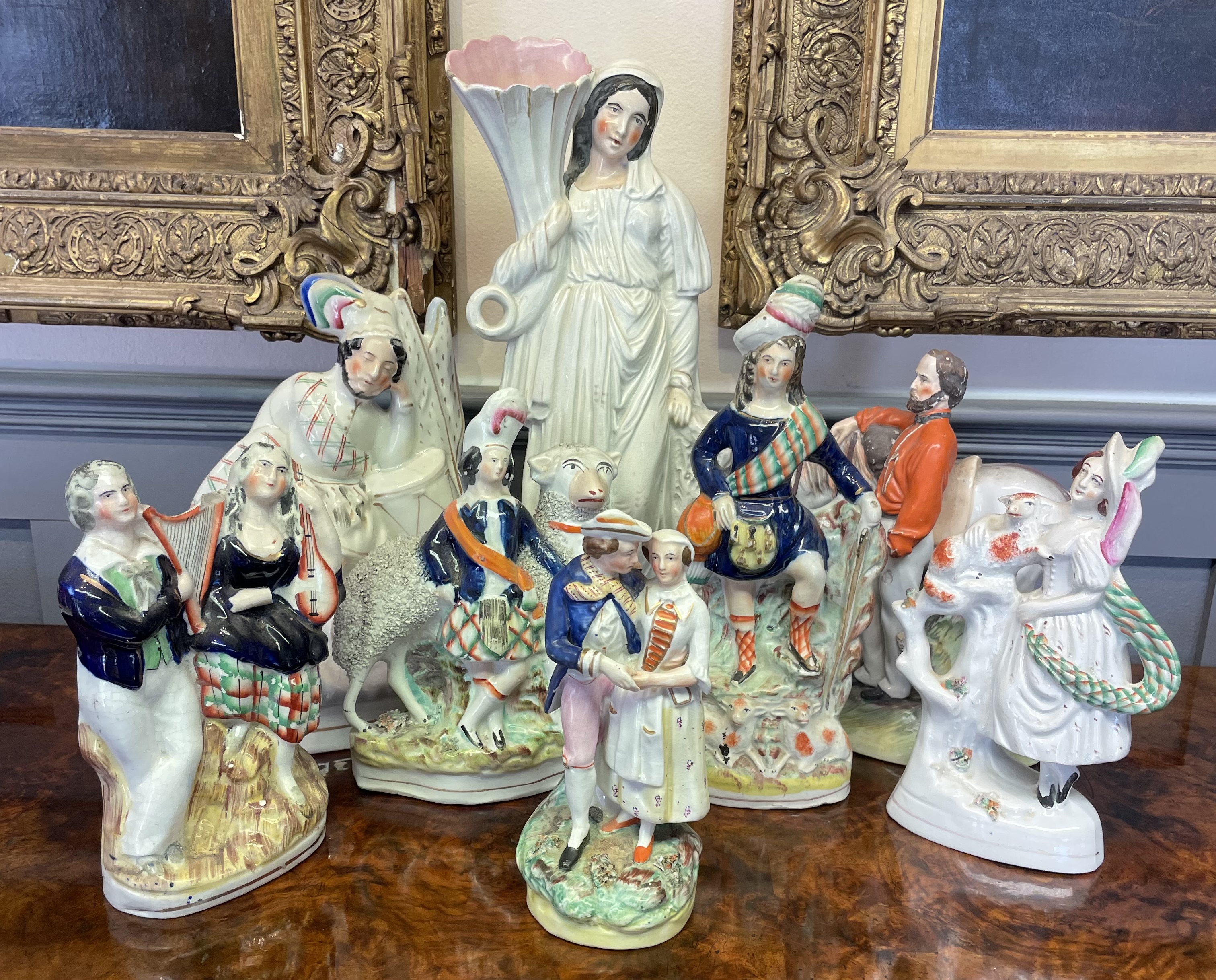 A Collection of Victorian Staffordshire Earthenware Figurines and Spill Vases