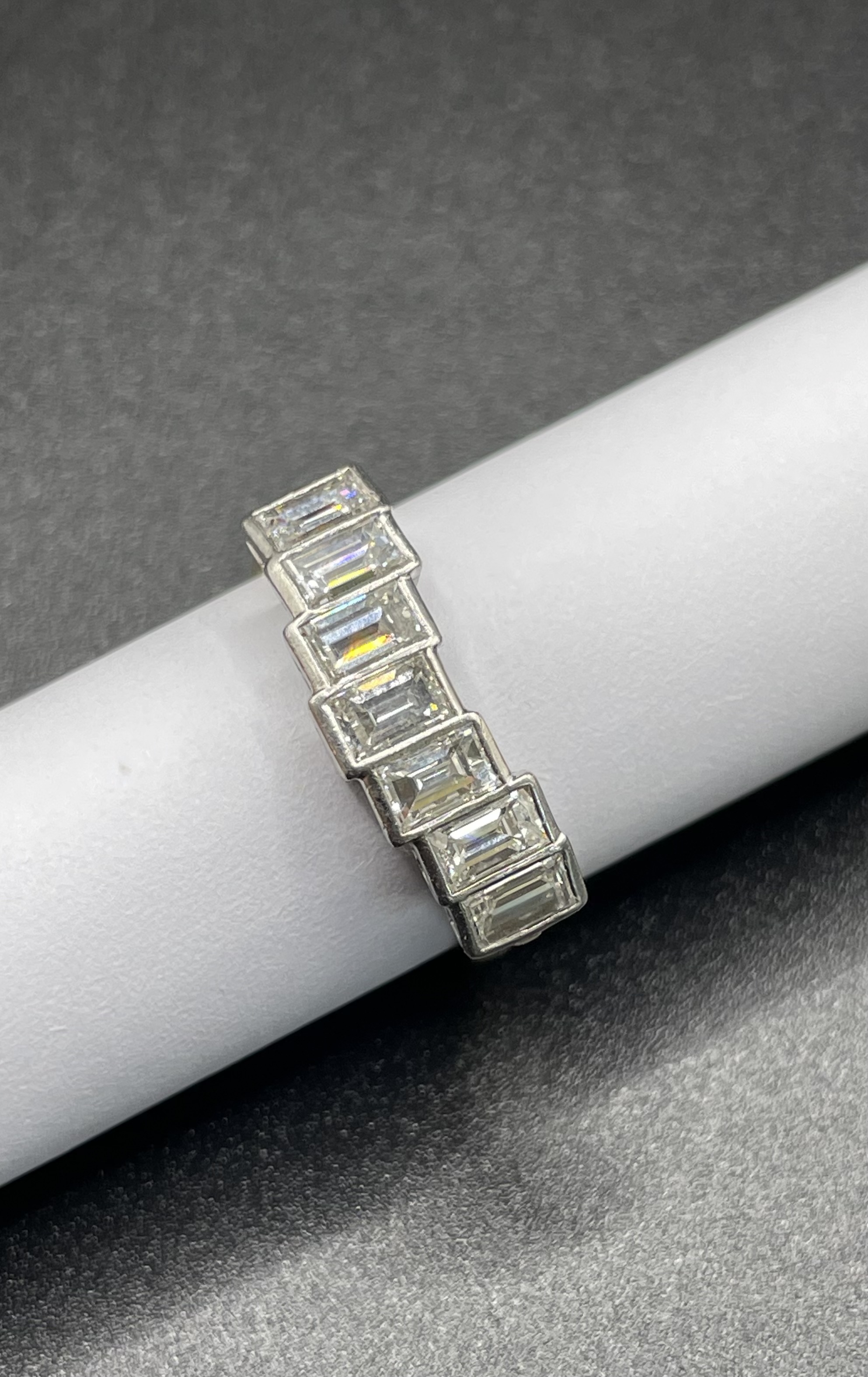 An 18 Karat Yellow and White Gold Seven Stone Diamond Eternity Ring