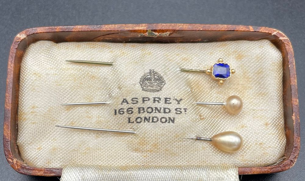 Lot 104 – Asprey Trio of Stick Pins with Blue Gemstone and Pearls in Original Box