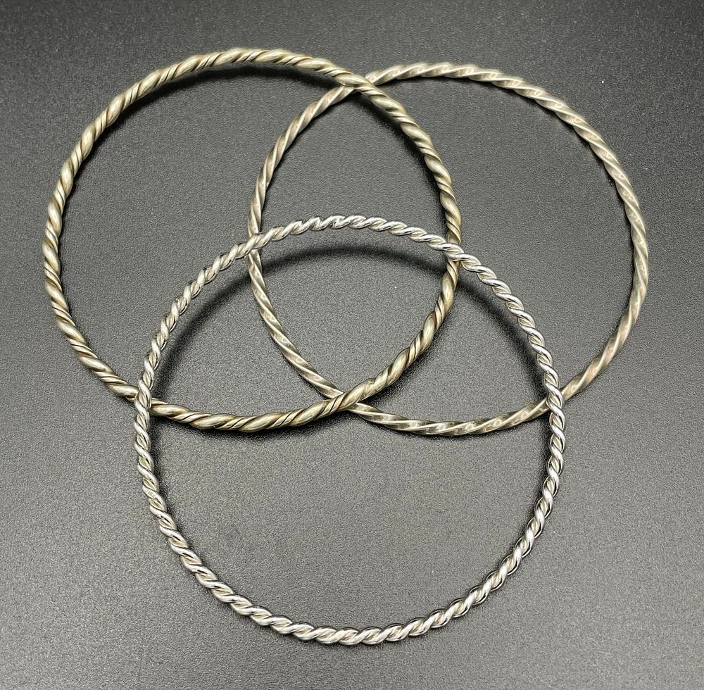 Lot 110 – A Trio of Twisted Wire Bangle Bracelets