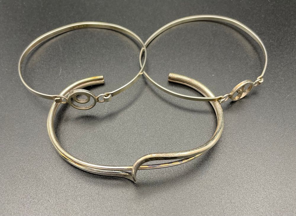 Lot 111 – Three Sterling Silver and Silver Tone Modernist Bangle Bracelets