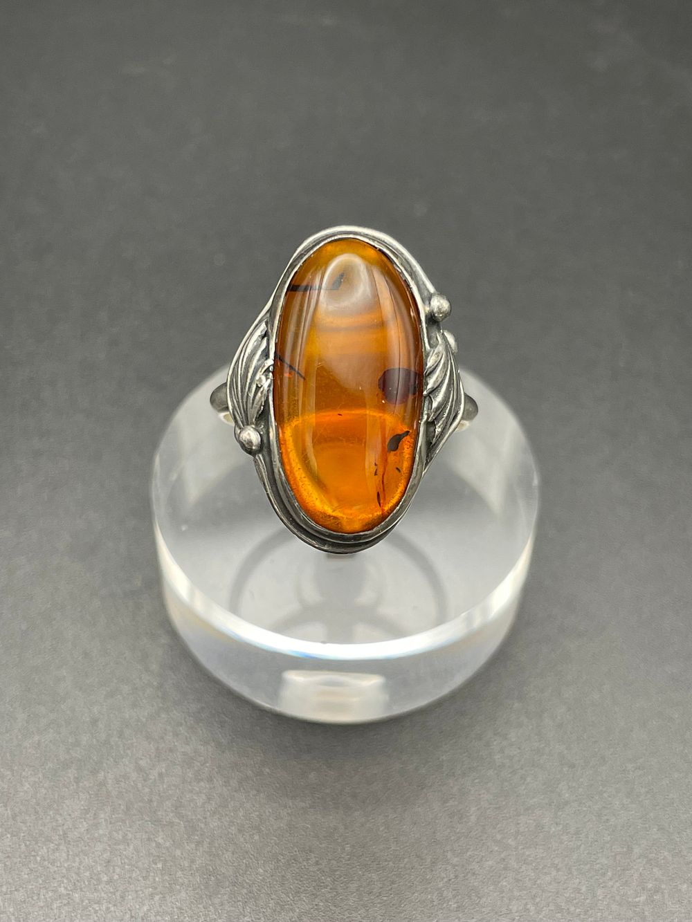 Lot 113 – Sterling Silver and Amber Cabochon Foliate Cocktail Ring