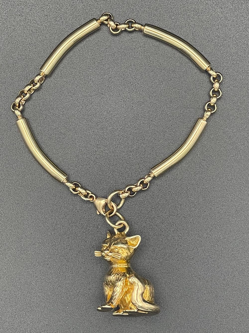 Lot 128 – 14 Karat Yellow Gold Cat Charm Bracelet