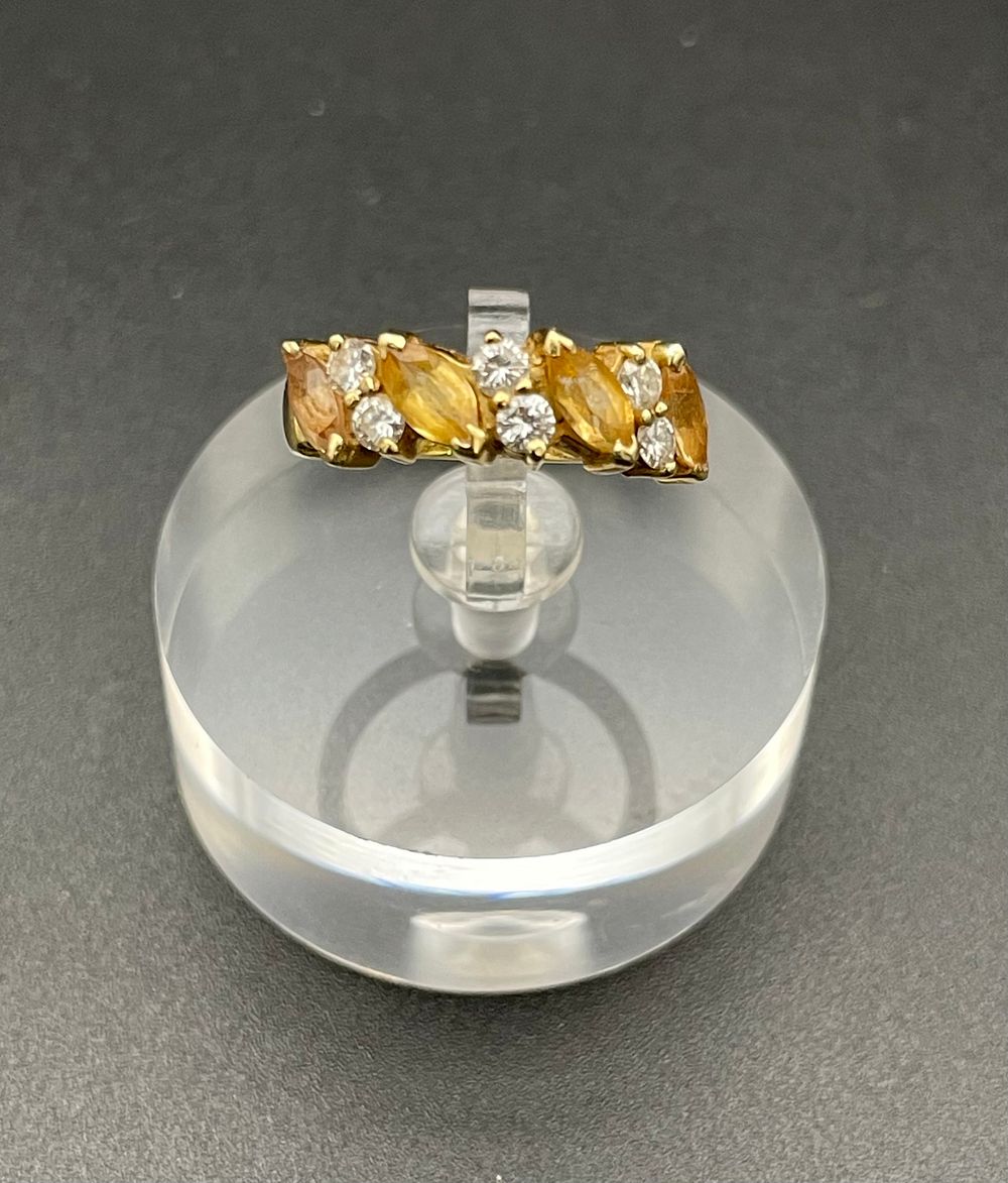 Lot 135 – Yellow Gold Multi Stone Bypass Ring Set With Marquise Cut Yellow Gemstones and Round White Accents