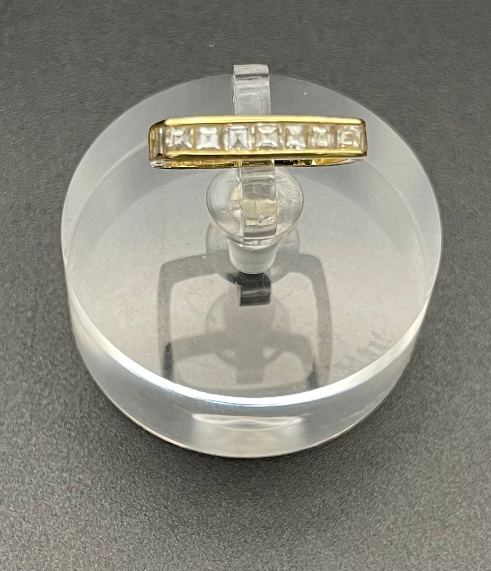 Lot 136 – 18 Karat Yellow Gold and Channel Set Diamond Square Shank Ring