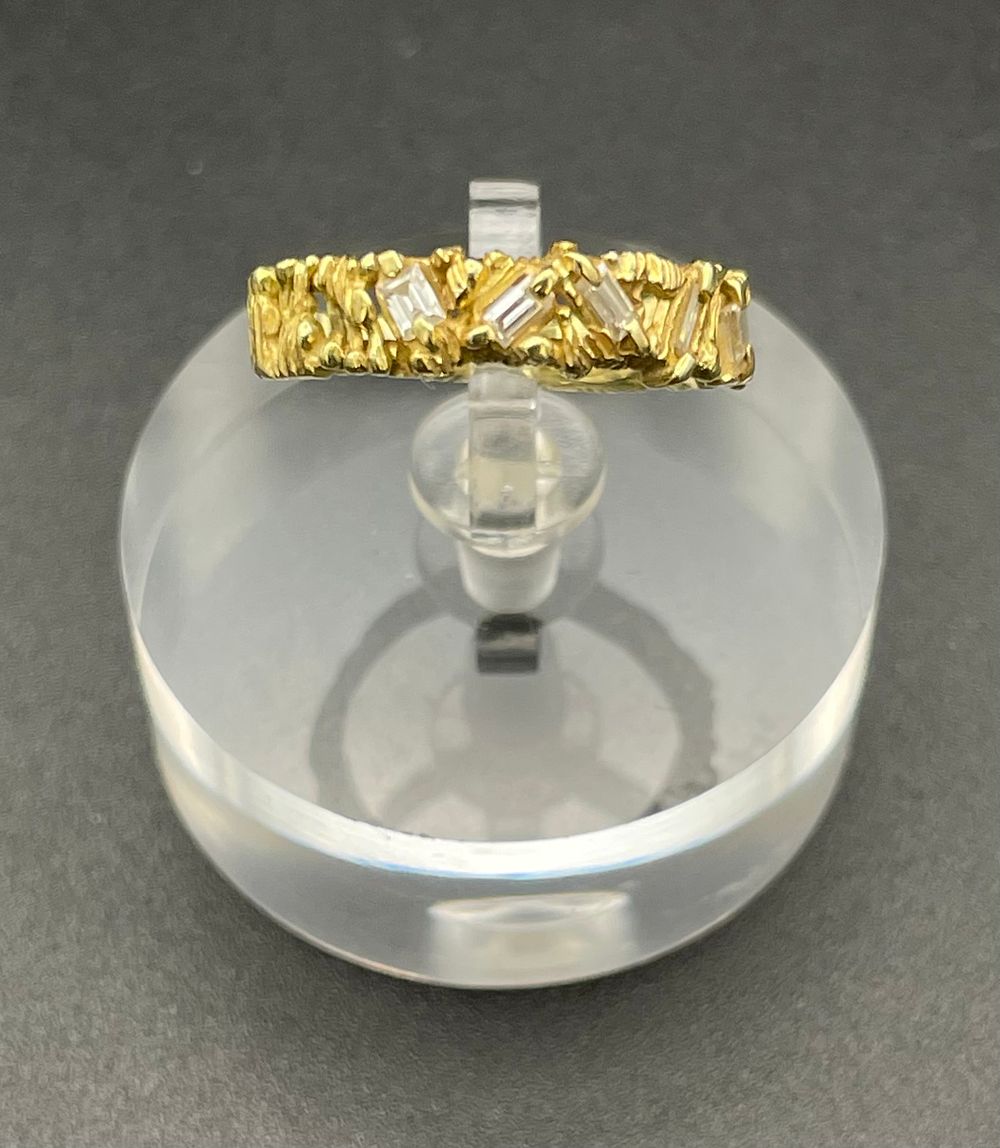 Lot 137 – 18K Yellow Gold and Baguette Cut Diamond Textured Band Ring