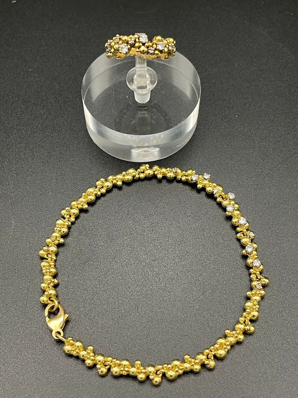 Lot 139 – A Pair of Yellow Gold Cluster Bead Jewelry Pieces Featuring a Bracelet and a Ring with Colorless Gemstones