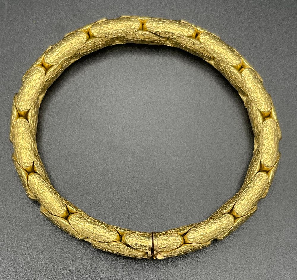 Lot 145 – 18 Karat Yellow Gold Articulated Bark Textured Link Bracelet