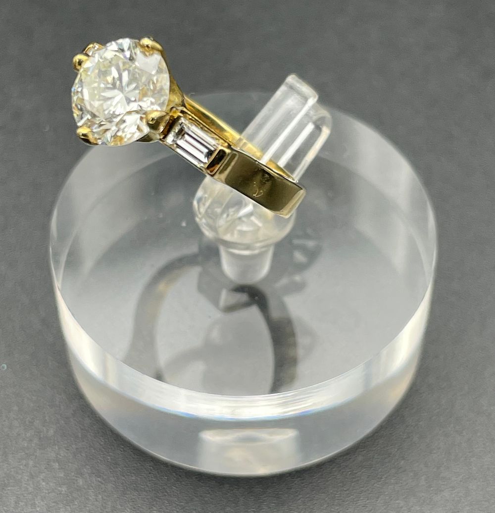 Lot 147 – 18 Karat Yellow Gold Three Stone Diamond Ring