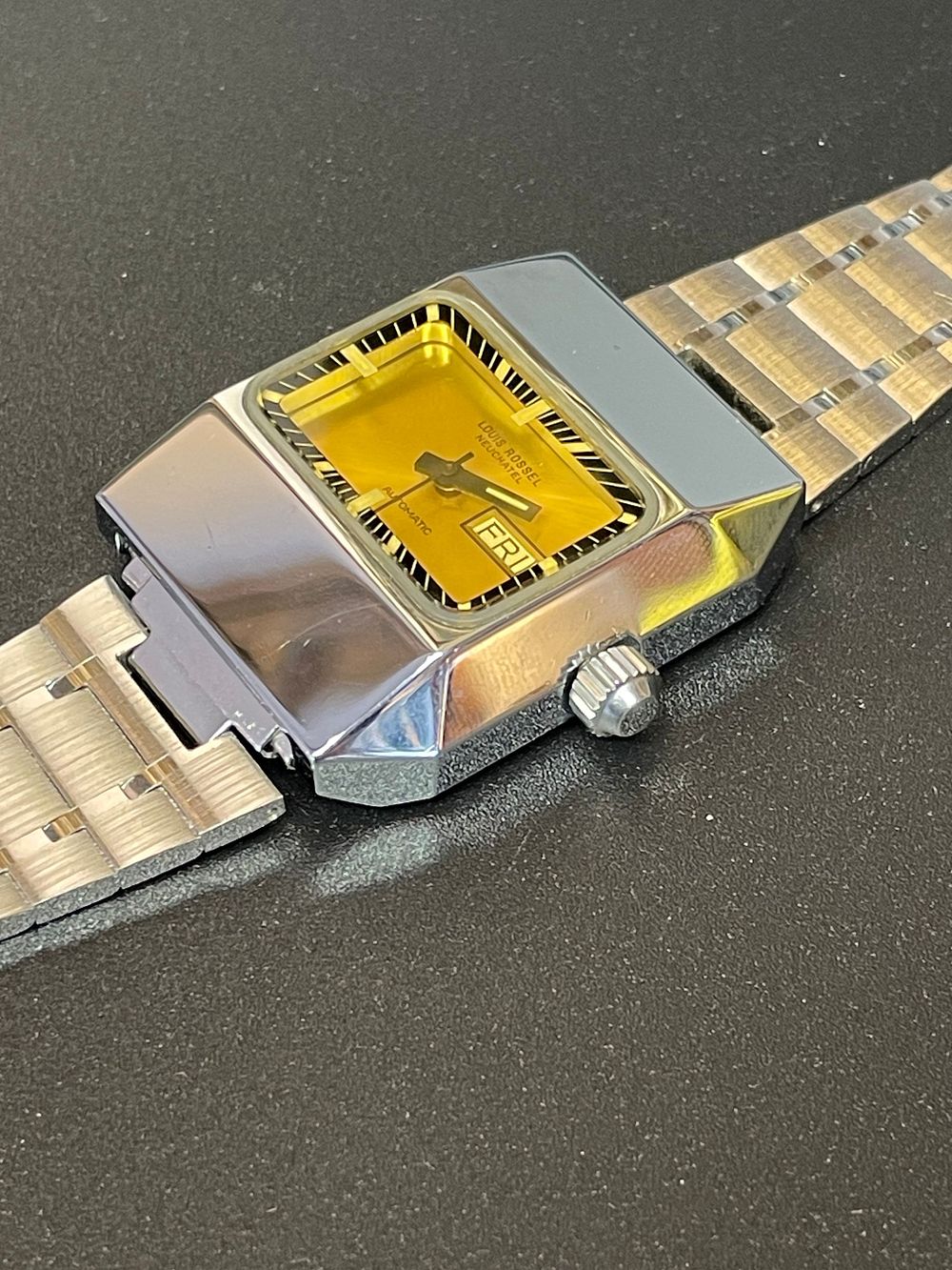 Lot 179 – Louis Rossel Stainless Steel Automatic Faceted Day-Date Wristwatch Reference 7727