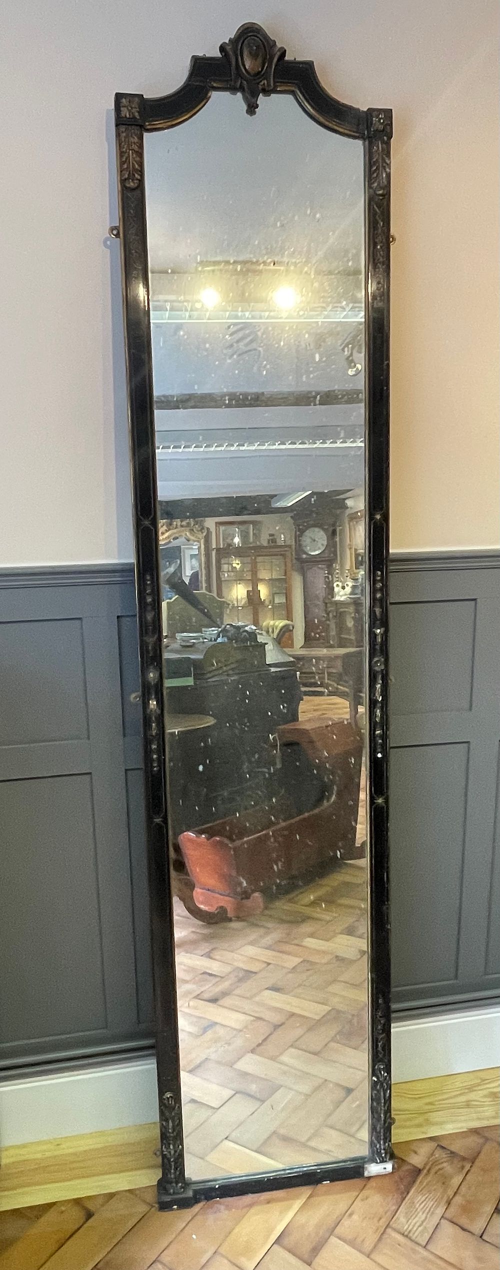 Lot 209 – Late 19th Century Neoclassical Style Ebonized and Parcel-Gilt Pier Mirror