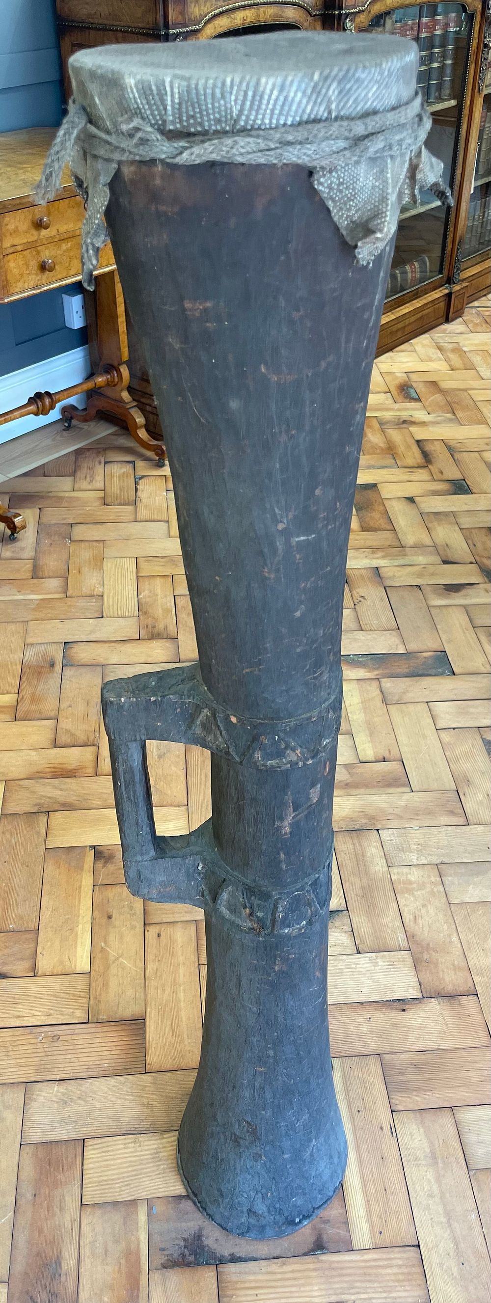 Lot 223 – A Large Papua New Guinea Carved Wood Kundu Drum with Lizard Skin Top