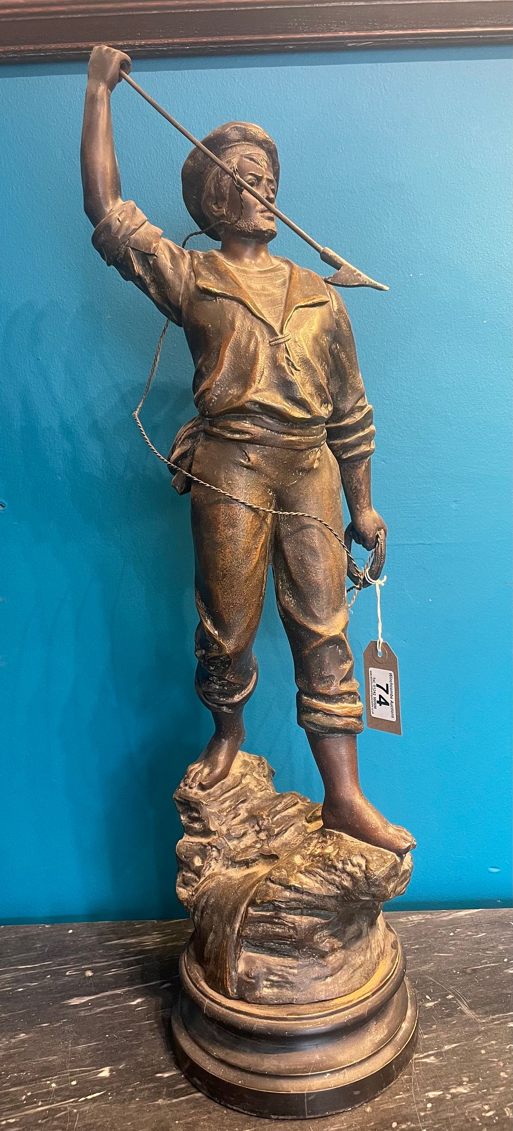 Lot 231 – A Large Bronzed Fisherman Figure