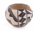 Two Handmade Native American Pottery Bowls. A pairing of two Native American pottery bowls from Image - 1