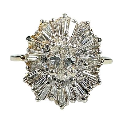 Ladies Vintage 14k Yellow Gold Ring with .5 Carat Oval Center and Round Halo Baguettes
. Ladies 