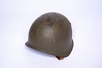 Set of 3 Army Helmets from the 1940s to the 1970s. The oldest helmet is from WWII and is a Image - 5