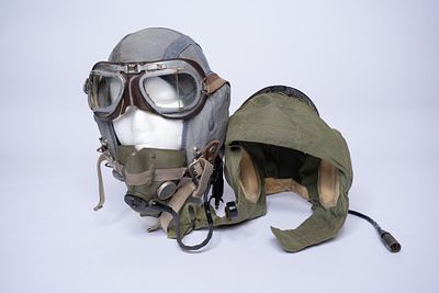 Pair of Fighter Pilot Helmets from Different Eras. 1956 RAF Blue Cloth Helmet size 3 with MK 