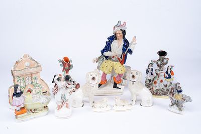 Collection of 11 Staffordshire Porcelain Figurines. 2 laying white sheep. 2 sitting white free 