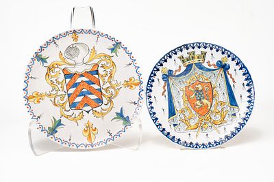 Pair of French Faience Alcide Chaumeil Plates. The larger plate depicts a coat of arms 