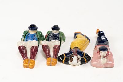 Lot of 4 French Faience Henriot Quimper Maillard Laying Figures. 1 man laying on stomach figure 