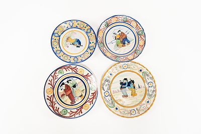 Lot of 4 French Faience HB Quimper Plates. 1 plate depicting two men playing instruments with 
