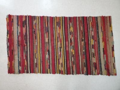 Vintage Knitted Folk Art Rug. Vintage folk art rug measuring 23.5 x 44 inches. Laura Fisher 