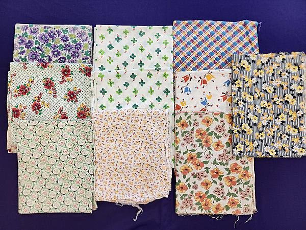 Lot 200: Group 1 of 10 Vintage Cotton Printed Feedsack Bags with flowers,  a pair of 4 leaf clovers, bells