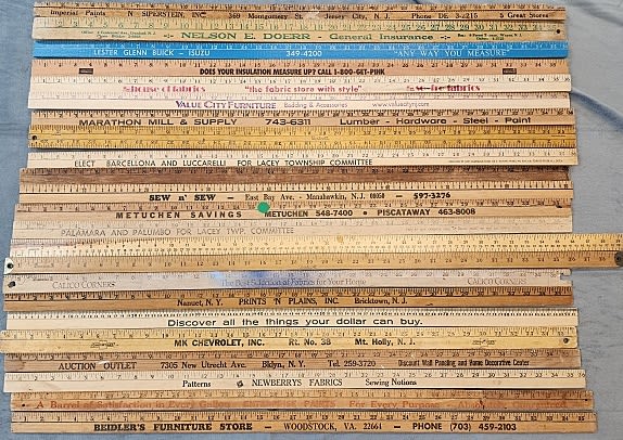 Lot 230: 23 Vintage Yard Sticks - Advertising
