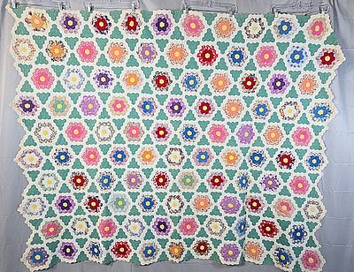 Vintage c1930 Grandmother Flower Garden Quilt in a Star Arrangement. It measures 67 by 83 