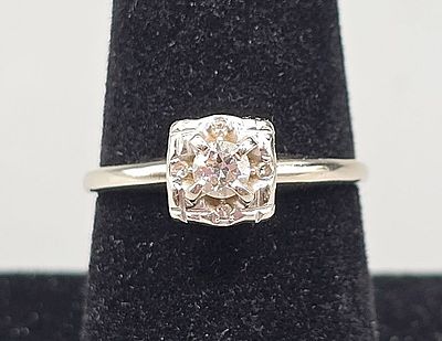 Vintage 14K Diamond Ring. The lot includes a vintage sz 8 late deco 14K white gold ring