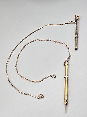 2, 19th Century Gold Filled Watch Chains and Mechanical Pencils. The lot includes a pair of
