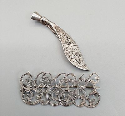 Pair of 19th Century Initial Brooches. The lot includes a pair of 19th century sterling initial