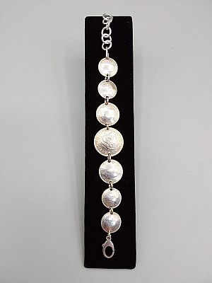 Early 1940s Australian Silver Coin Bracelet. The lot includes an adjustable vintage 1940s