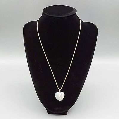 18K Chain with Heart Pendant. Marked 18K 18" chain with a 3/4" tall Mother of Pearl and Quartz