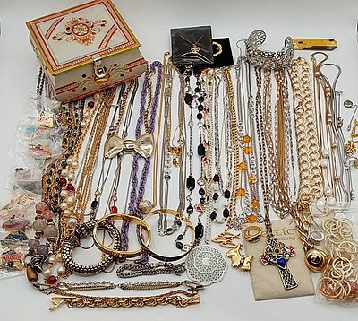 Gold and Silver Tone Jewelry. Assorted grouping of gold and silver tone necklaces, brooches