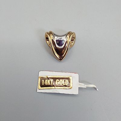 14K Triangular Pendant. A marked and signed white and yellow gold triangular pendant (1" High x