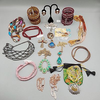 Signed Costume Jewelry. Sixteen pieces of signed costume jewelry to include Two "Hot in