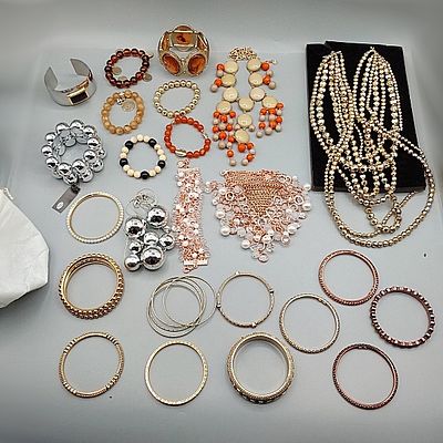 R.J. Graziano Jewelry. To include fifteen Gold, Silver and Bronze toned bangle bracelets (Some