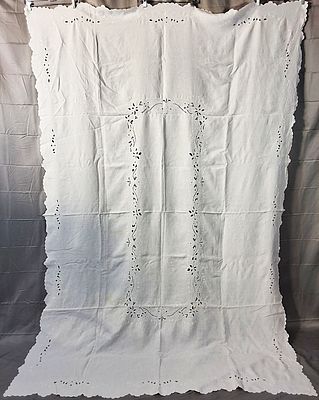 Vintage White Linen Tablecloth Set. There is a vintage white tablecloth with 12 napkins. The 