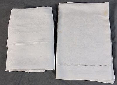 Pair of Vintage White Damask Linen Tablecloths. There is a white linen damask tablecloth that 